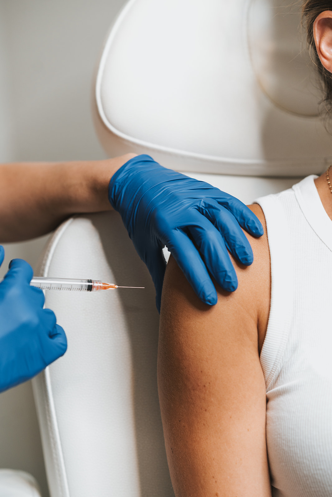 Aesthetic practitioner administering Botox injections to a patient’s forehead, illustrating the procedure discussed in the ultimate guide to Botox treatments.