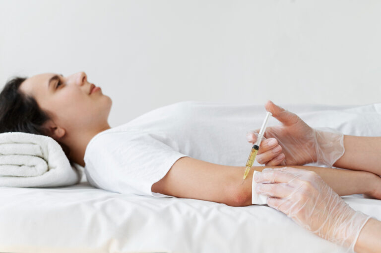 Medical professional administering Botox or dermal filler injection, illustrating treatment differences and benefits in Peabody.