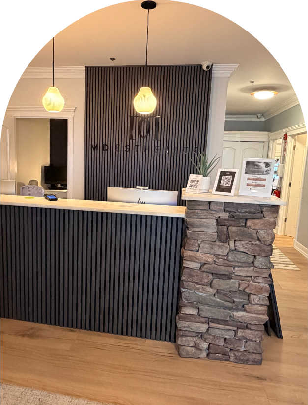 Front desk area at MD Esthetics Canton, MA location, showcasing a modern and inviting design.