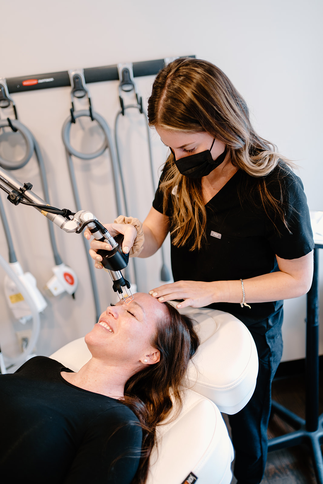 MD Esthetics Aesthetic practitioner administering Botox injections to a patient’s forehead, illustrating the procedure discussed in the ultimate guide to Botox treatments.
